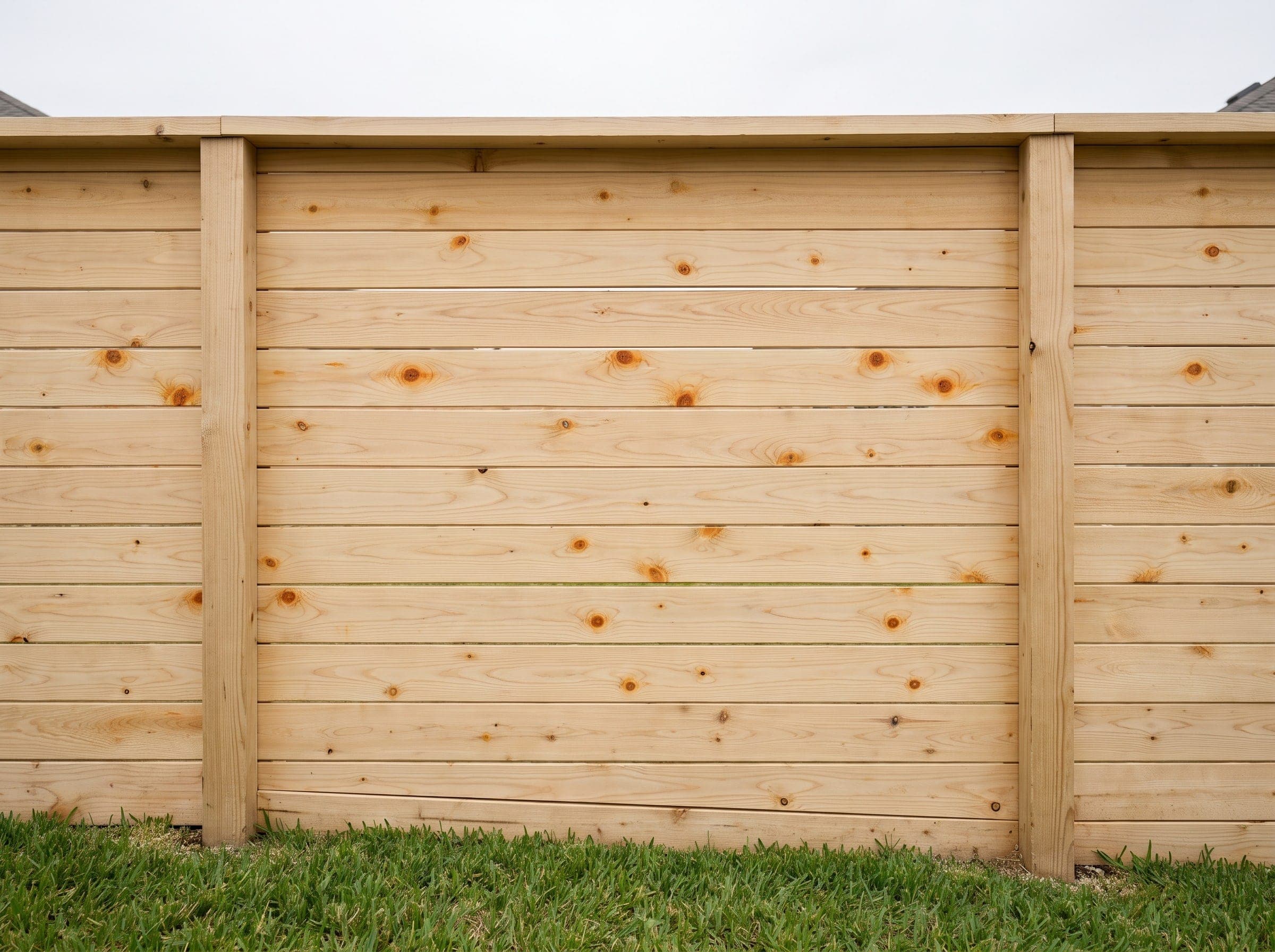 A horizontal fence installed on a Texas property.