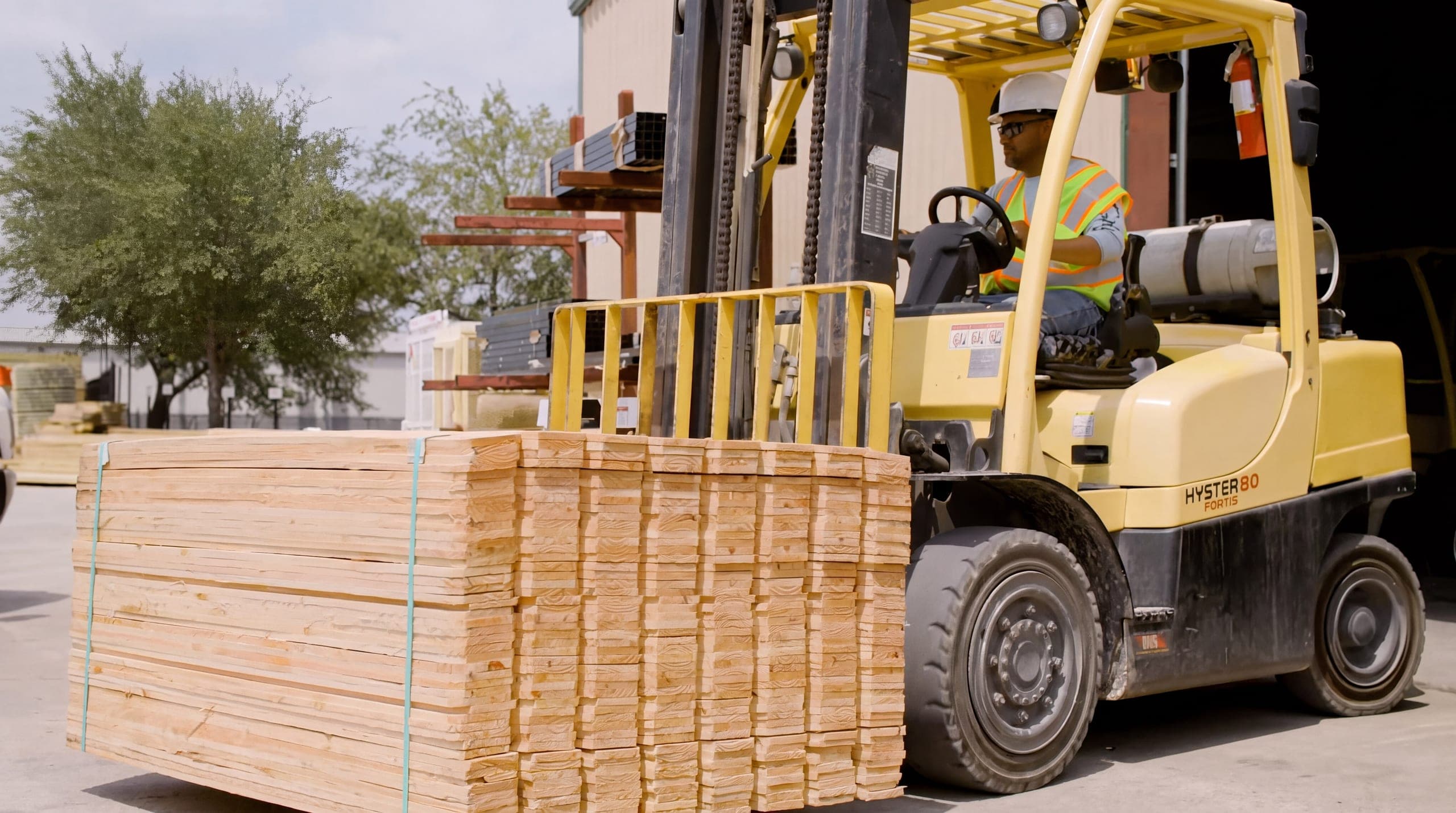 A banded bundle of fence pickets leaving the Johnson yard on a forklift